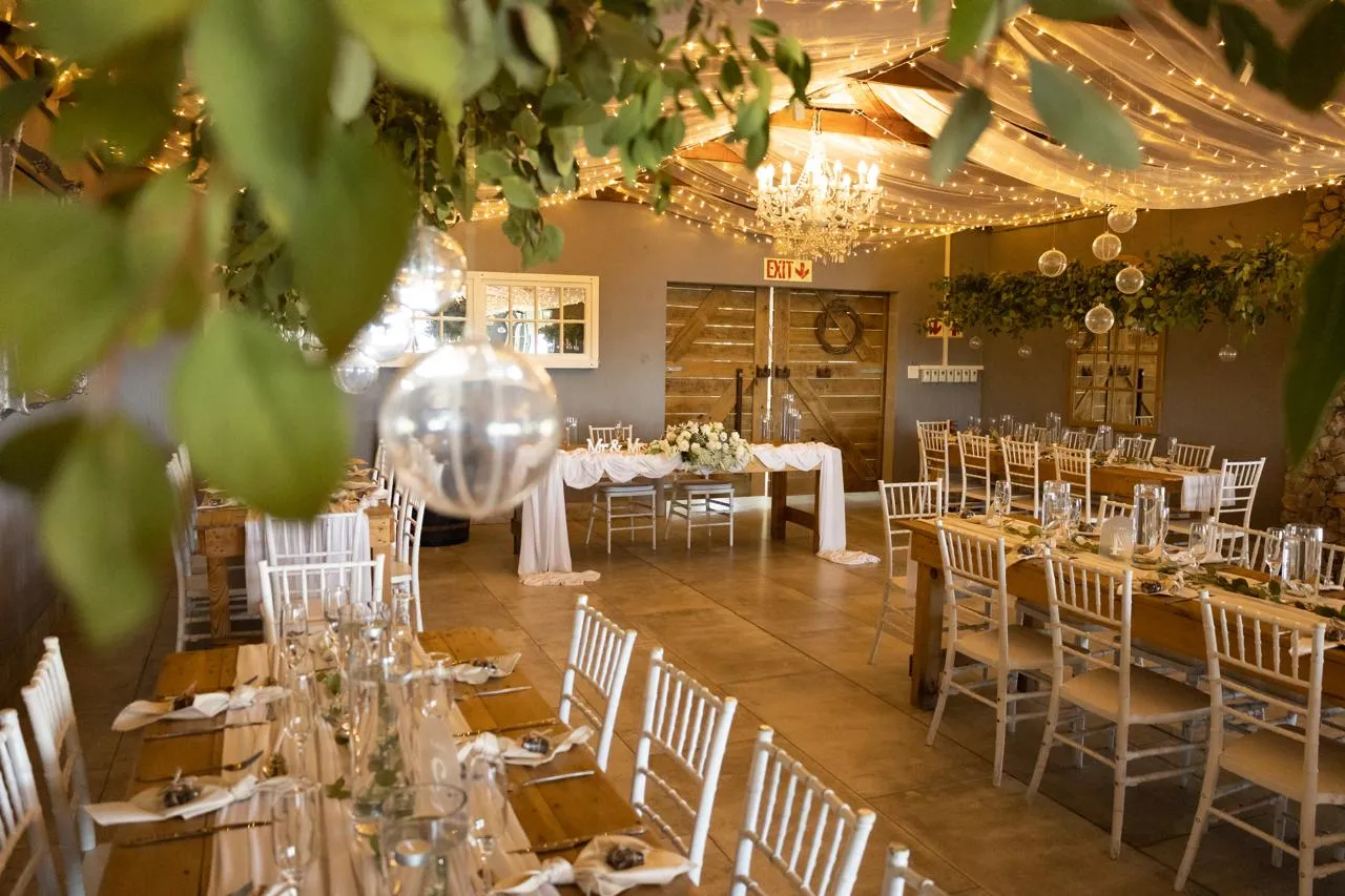 Stonehaven’s reception room with chandeliers and fairy lights